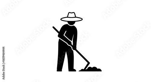 A man hoeing the ground black and white