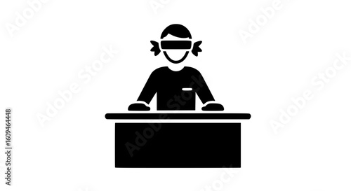 A blindfolded person sitting at a table