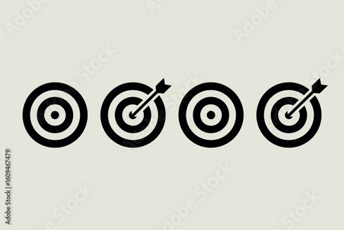 Four black and white target icons with arrows hitting the bullseye