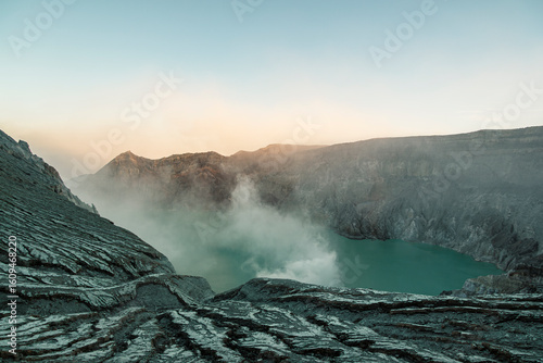 Sunrise image of Kawah Ijen, a beautiful turquoise crater lake in the stratovolcano Mount Ijen, located in East Java, a province on Indonesia's Java island