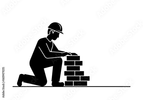 A construction worker laying bricks, depicted as a silhouette on a white background