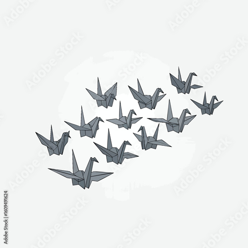 A flock of grey origami paper cranes flying in formation.