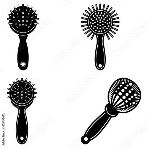 Collection of four black and white cocktail strainers with different designs and handle shapes shown