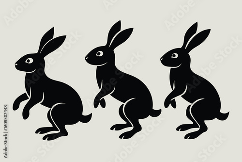 Three stylized black rabbits standing on hind legs against a light background