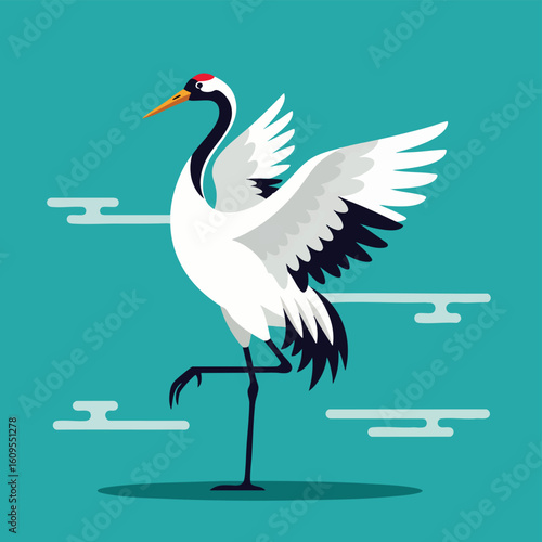 Graceful Japanese red-crowned crane standing elegantly on one leg with its wings spread.