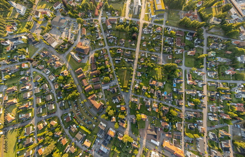 Fototapeta Naklejka Na Ścianę i Meble -  Wide-angle aerial panorama of a small Swedish town with residential and private houses, streets, greenery, and urban infrastructure, captured by drone