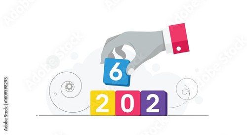 A hand placing a '6' block on a 2026 block, symbolizing a new year's beginning.