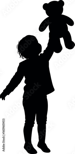 Joyful Child Holding Teddy Bear Up Silhouette