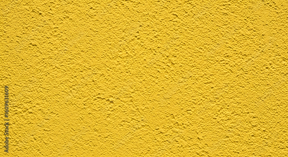 Textured Yellow Wall Surface with Rough Stucco Finish. Textured Yellow Wall Surface with Rough Stucco Finish.