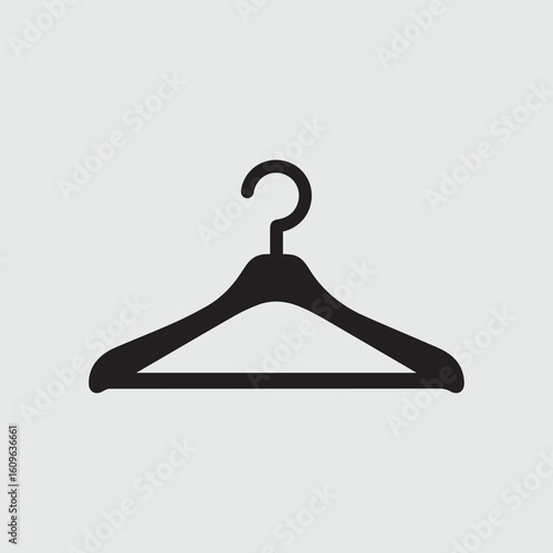 Simple black silhouette of a wooden clothes hanger on a light gray background
