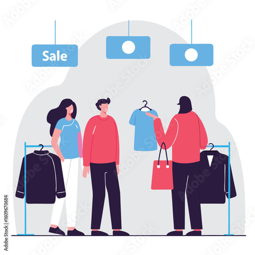 Customers browsing clothing racks in a store during a sale with a sales associate holding up a shirt for consideration