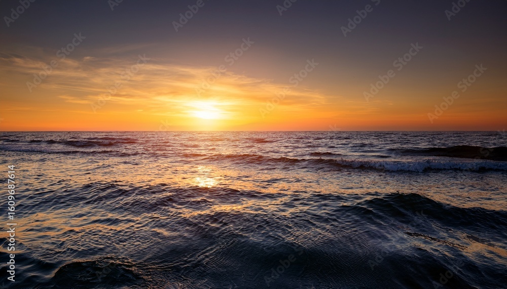 Obraz premium tranquil ocean view with calm waves under golden sunset minimalist seascape with copy space conveying peace relaxation and freedom of coastal life