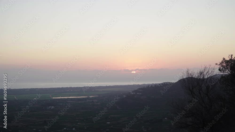 Landscape with the sun rising in the horizon. Zoom in. Landscape with the sun rising in the horizon. Zoom in.