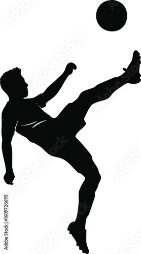Silhouette of a soccer player executing a high volley kick
