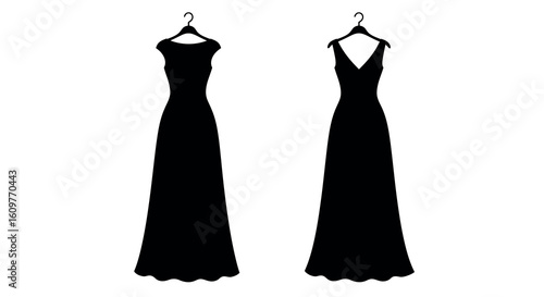 Elegant silhouette of long evening dresses on hangers