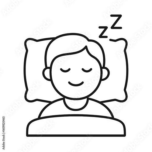 Young boy sleeping peacefully on a pillow at home with restful expression  