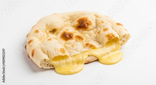 A warm, cheese-stuffed naan bread torn open with melted, gooey cheese spilling out onto a white surface.