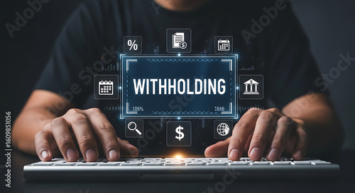 Wallpaper Mural A person is typing on a keyboard with a digital display showing the word withholding Torontodigital.ca