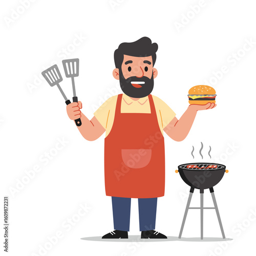 Man in apron holds a burger with spatulas in the other next to a charcoal grill