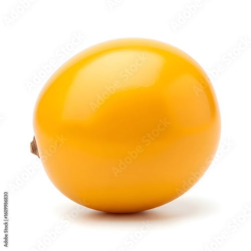 Whole marula fruit with yellow skin, isolated on clean white background, studio lighting