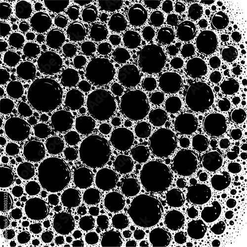 Monochromatic view of numerous black bubbles of varying sizes closely packed together with white outlines