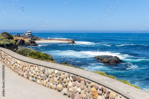 The lifeguard station and the historic La Jolla Children's Pool. The seawall was built in 1931 as a play area for children and to protect them from the waves.  