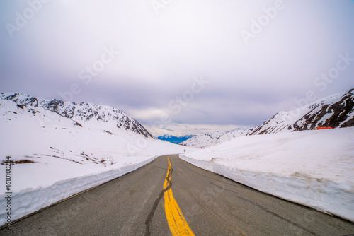 Winding Mountain Road Through Snowy Pass