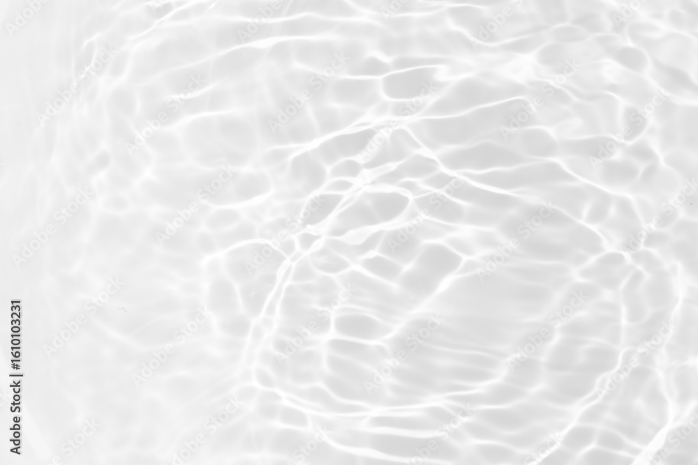 Obraz premium White water with ripples on the surface. Defocus blurred transparent white colored clear calm water surface texture with splashes and bubbles. Water waves with shining pattern texture background.