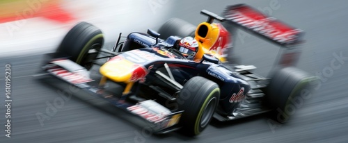 Dynamic Racing Car in Motion on Track Capturing Speed and Power with Red Bull Branding in Action