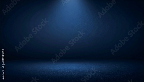マットなダークネイビーの背景に中央の柔らかいスポットライトと微細な粒子感を加えた大胆なタイポグラフィに最適なデザイン


