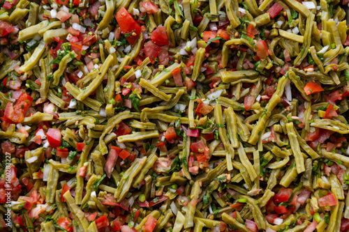 Fresh chopped Nopales Salad with tomatoes and onions 