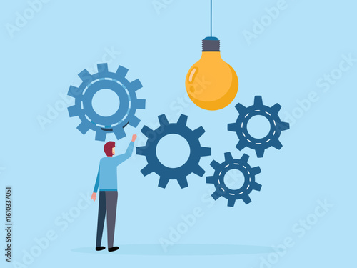 Man turning gears under a light bulb representing ideas and innovation