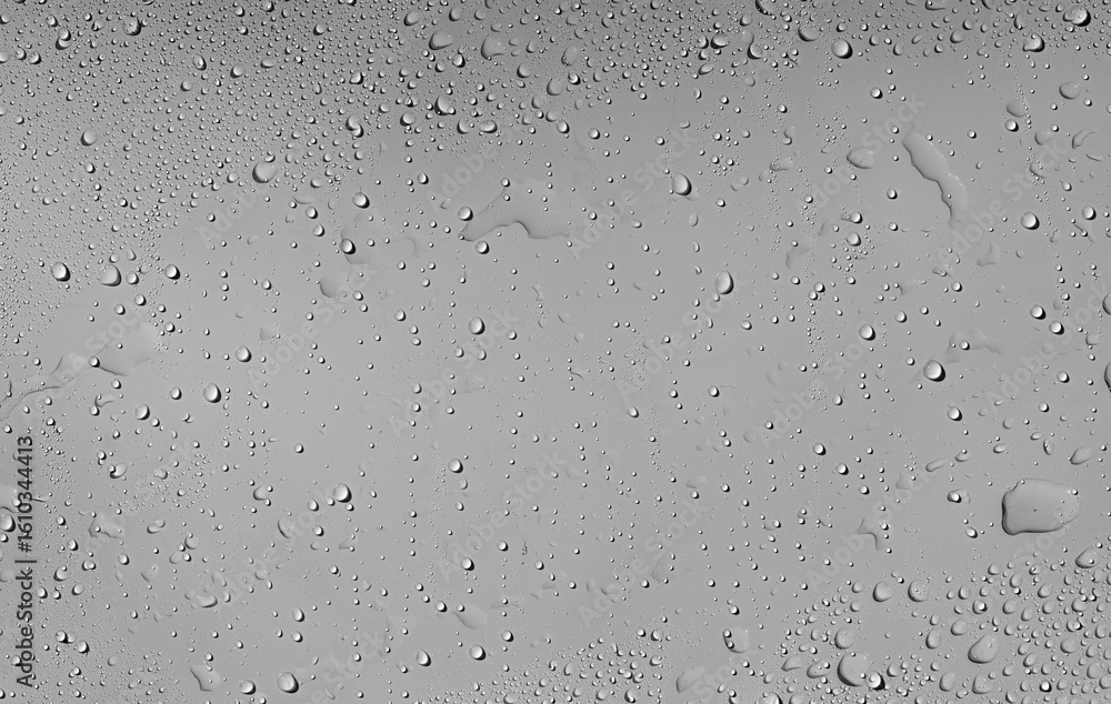 Misty Surface Droplets. A macro shot of water droplets condensed on a light-colored surface. The droplets are randomly scattered, creating a natural and soft texture ideal for backgrounds or scientifi Misty Surface Droplets. A macro shot of water droplets condensed on a light-colored surface. The droplets are randomly scattered, creating a natural and soft texture ideal for backgrounds or scientifi