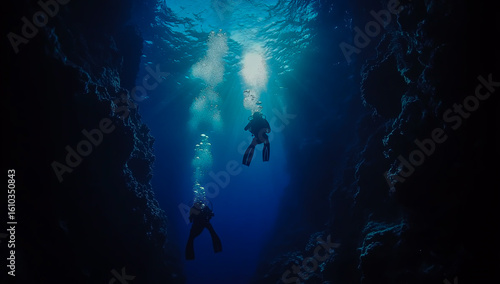 Wallpaper Mural Two divers are exploring the deep blue sea, surrounded by vibrant coral reefs and a variety of marine life visible through the bubbles of their equipment. Torontodigital.ca