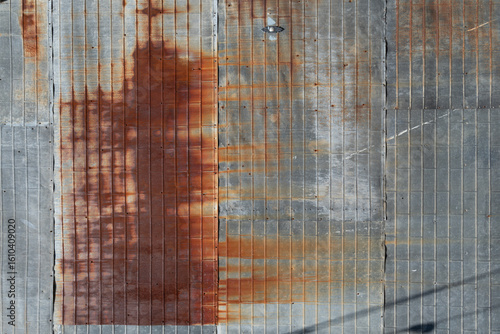 Rust patterns spread across a grid-like metal surface