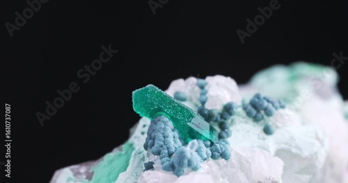 Dioptase green crystal sugar-covered with small quartz, on Dark green plancheite balls on Chrysocolla.  Specimen from Omaue Mine, Namibia.
