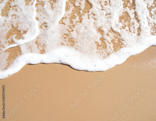 Aerial View of Ocean Foam on Sandy Shore: Top Down Perspective of Sea Wave Splashing Beach for Nature, Travel, and Coastal Landscape Concepts