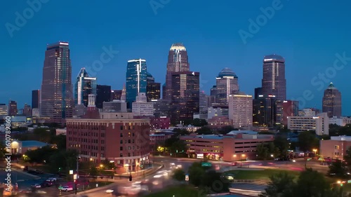 Cityscape view of kansas city missouri skyline at dusk with tall buildings and street lights visible