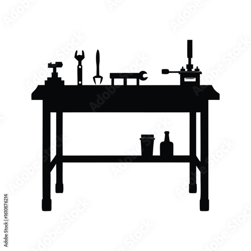 Black and white silhouette of a workshop table with tools and objects