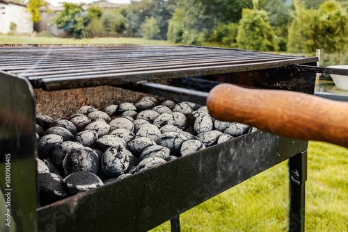 Close up of a burning charcoal briquettes in a grill ready for bbq.