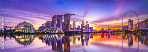 Photography View of the skyline at the Downtown Core along Marina Bay at dusk in Singapore