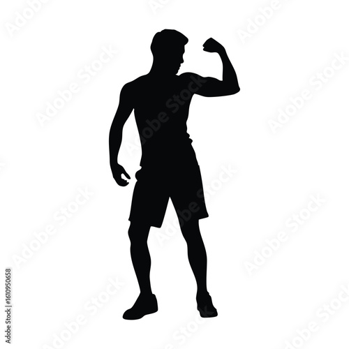 Silhouette of a Fit Man Flexing His Muscles in a Strong Pose