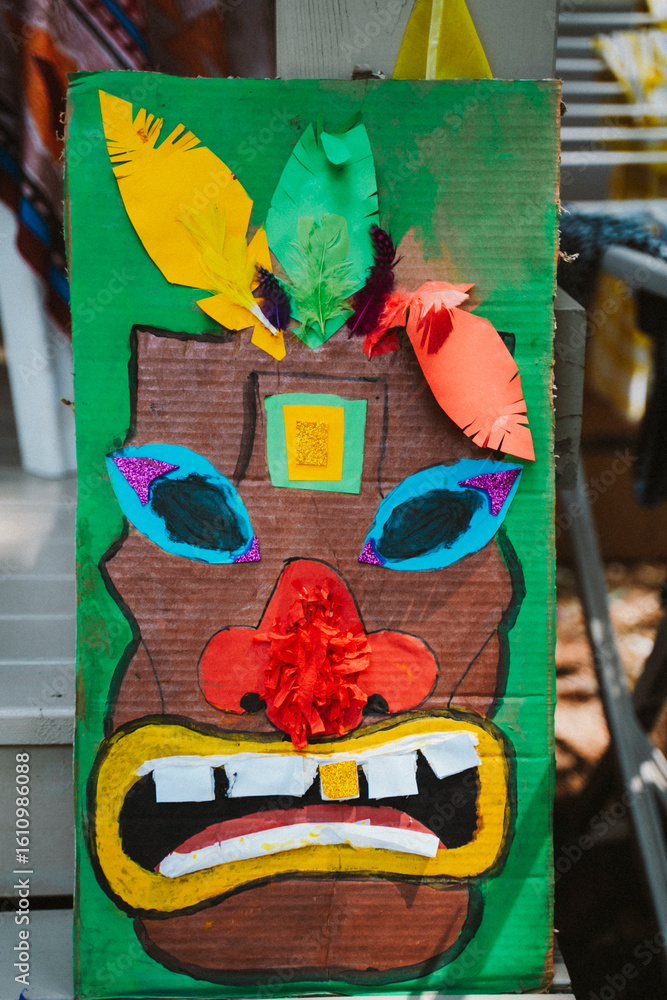 Naklejka premium Colorful Cardboard Mask with Feathers and Decorations