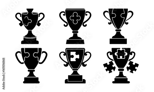 Collection of six black silhouette trophy cups with puzzle piece design