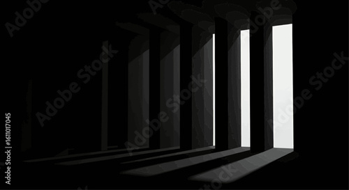 Dark interior space with stark light beams illuminating a hallway.