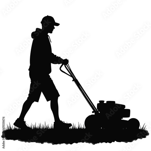 Silhouette of a person mowing a lawn grass