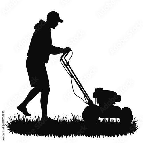 Silhouette of a person mowing a lawn grass
