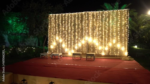 Indian Wedding Stage Decorated for Pooja Ritual with Fairy Lights Backdrop