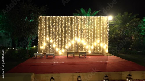 Indian Wedding Stage Decorated for Pooja Ritual with Fairy Lights Backdrop