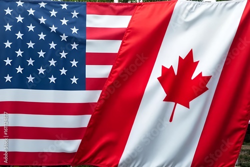 United States and Canadian flags side by side, symbolizing cross-border relations, trade agreements, and international diplomacy. Tariffs, taxation, NAFTA/USMCA, and economic policy
